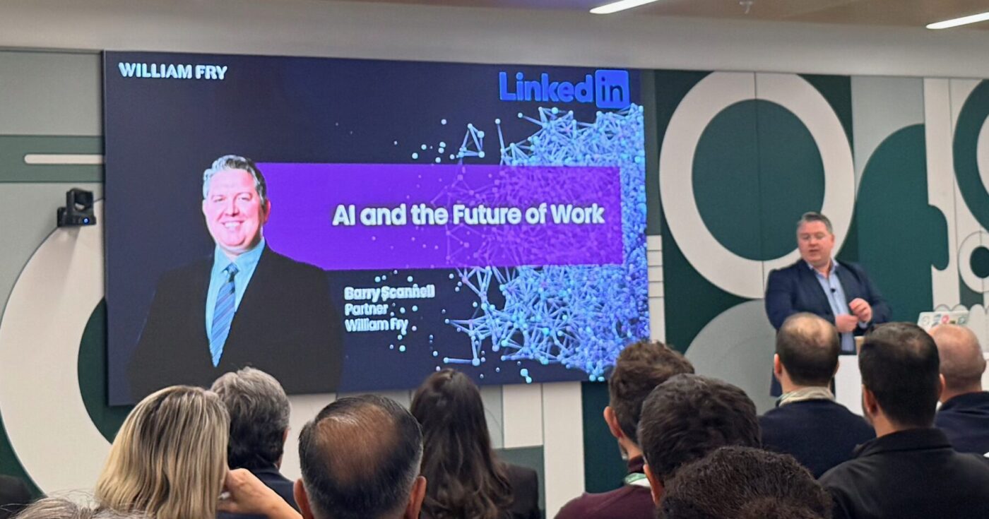 Speaker discussing AI policy and ethics at LinkedIn Partners Unite 2025 event